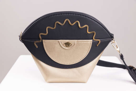 Dual-Tone Elegance: Black and Gold Eye-Inspired Handbag - Image 2